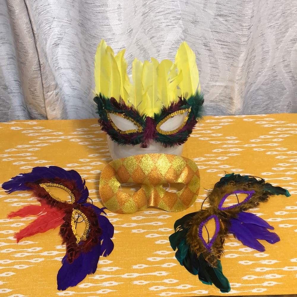 A group of 4 masquerade masks